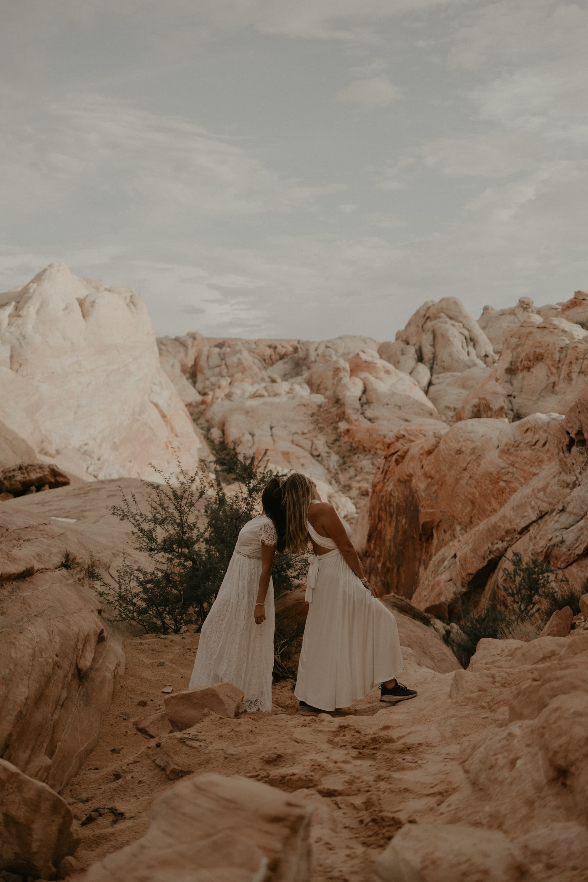 Brides on their hiking elopement in Moab, Utah