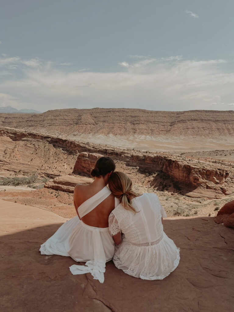 Brides admiring the desert landscape at Arches National Park